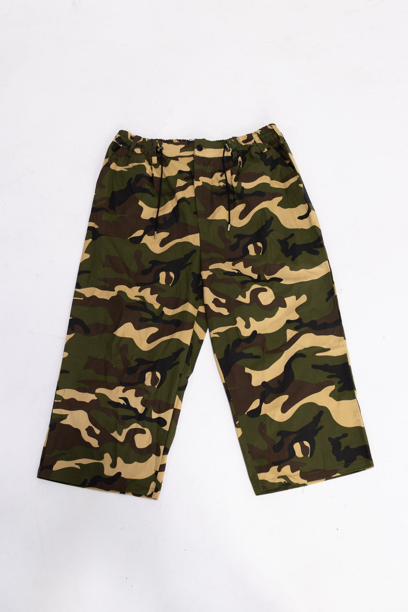 Camo wide leg pants flatlay showing oversized fit and streetwear design